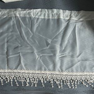 Sheer cream curtains with lace bottoms